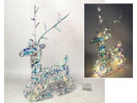 Dekoracja na stelażu z drutu z folią holograficzną  RENIFER leżący 50 LED świecąca 45x30x9 cm